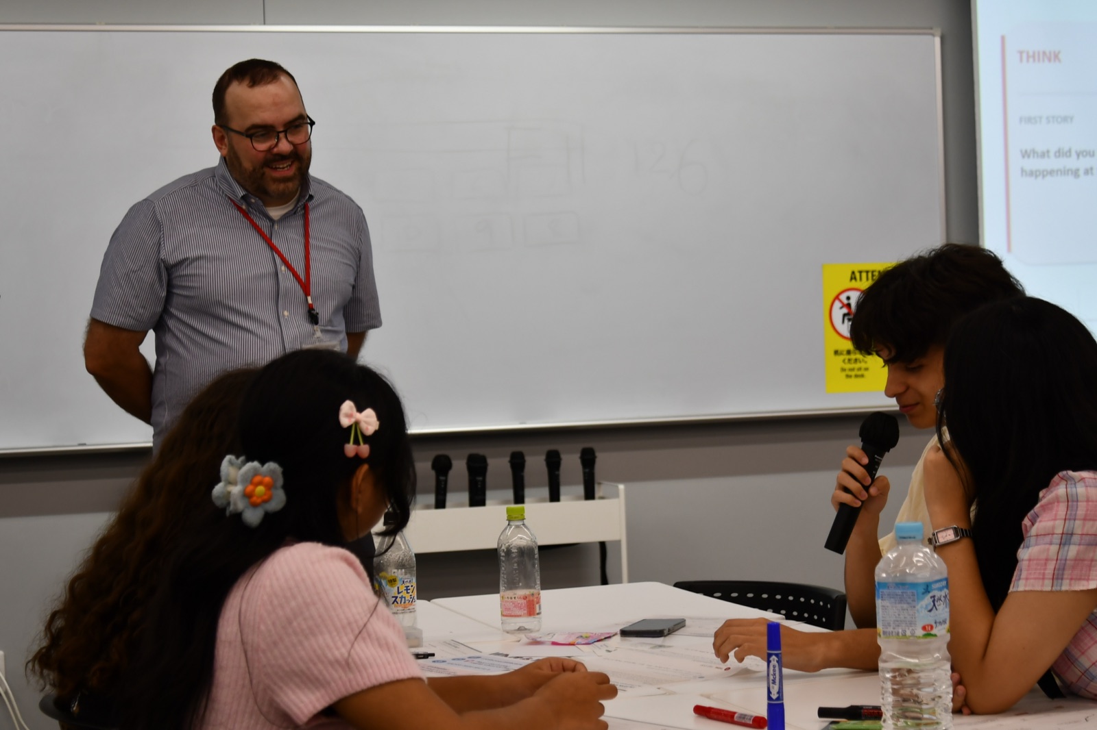 Michał Mazur facilitating an intercultural learning activity with AFS participants at APU.